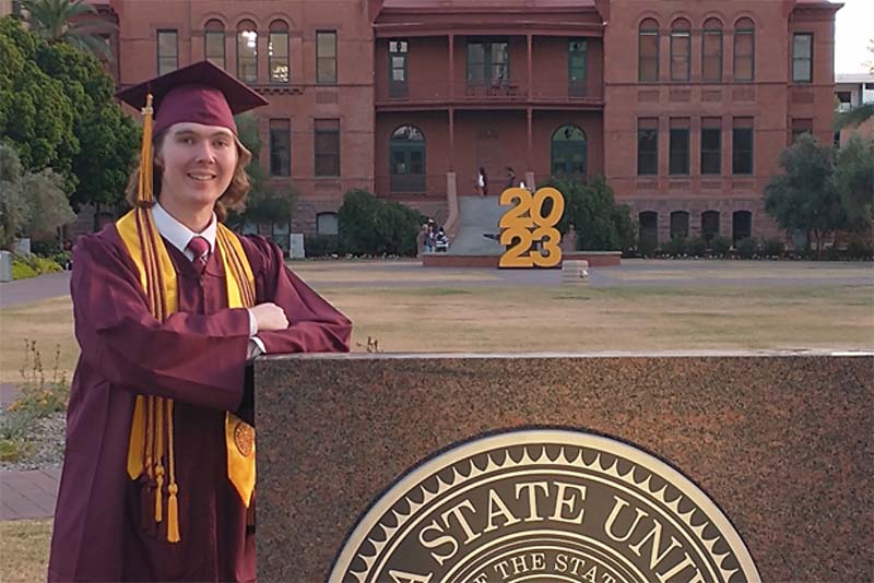 Samuel Watson graduation portrait in regalia on the ASU campus